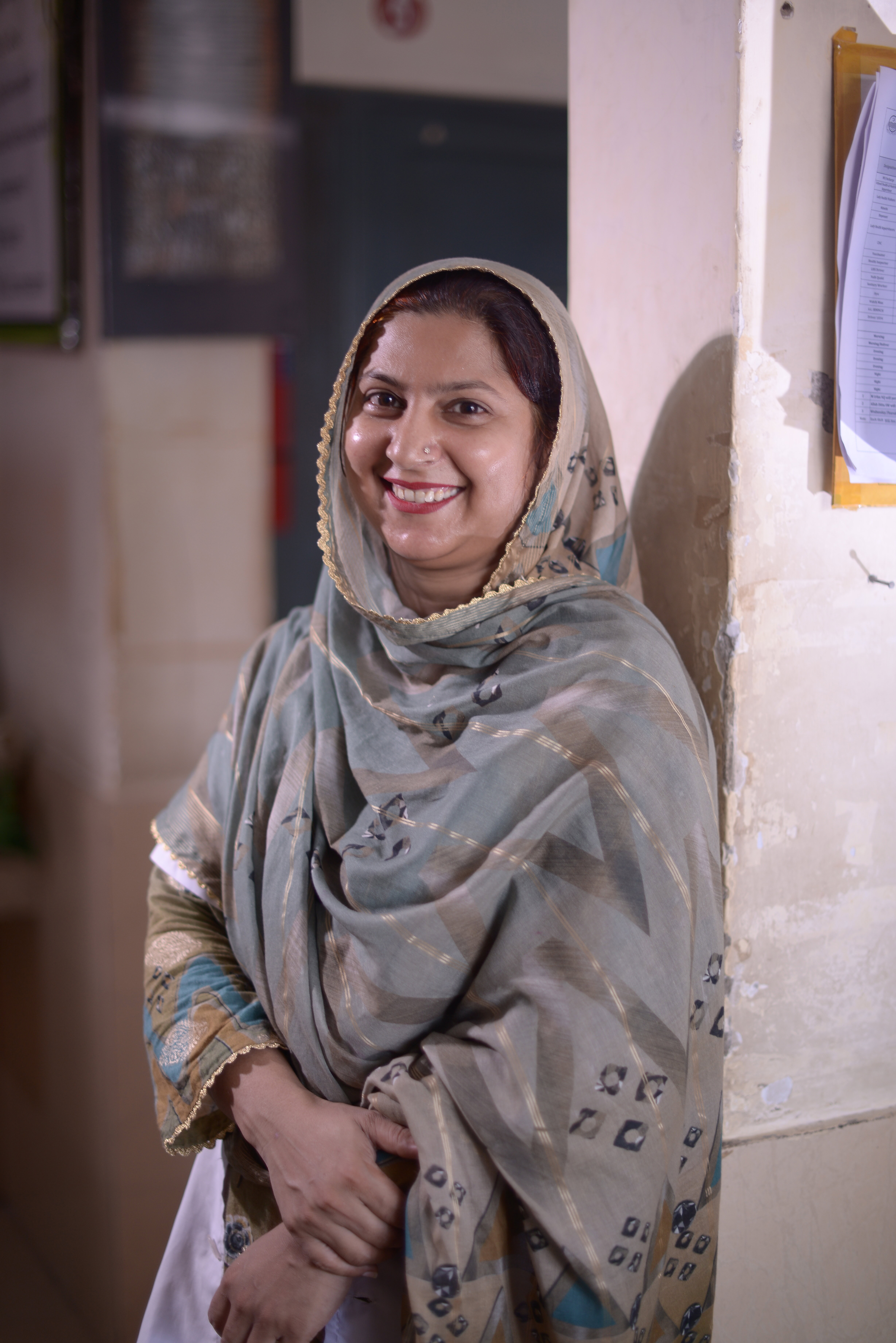 A woman smiles to camera