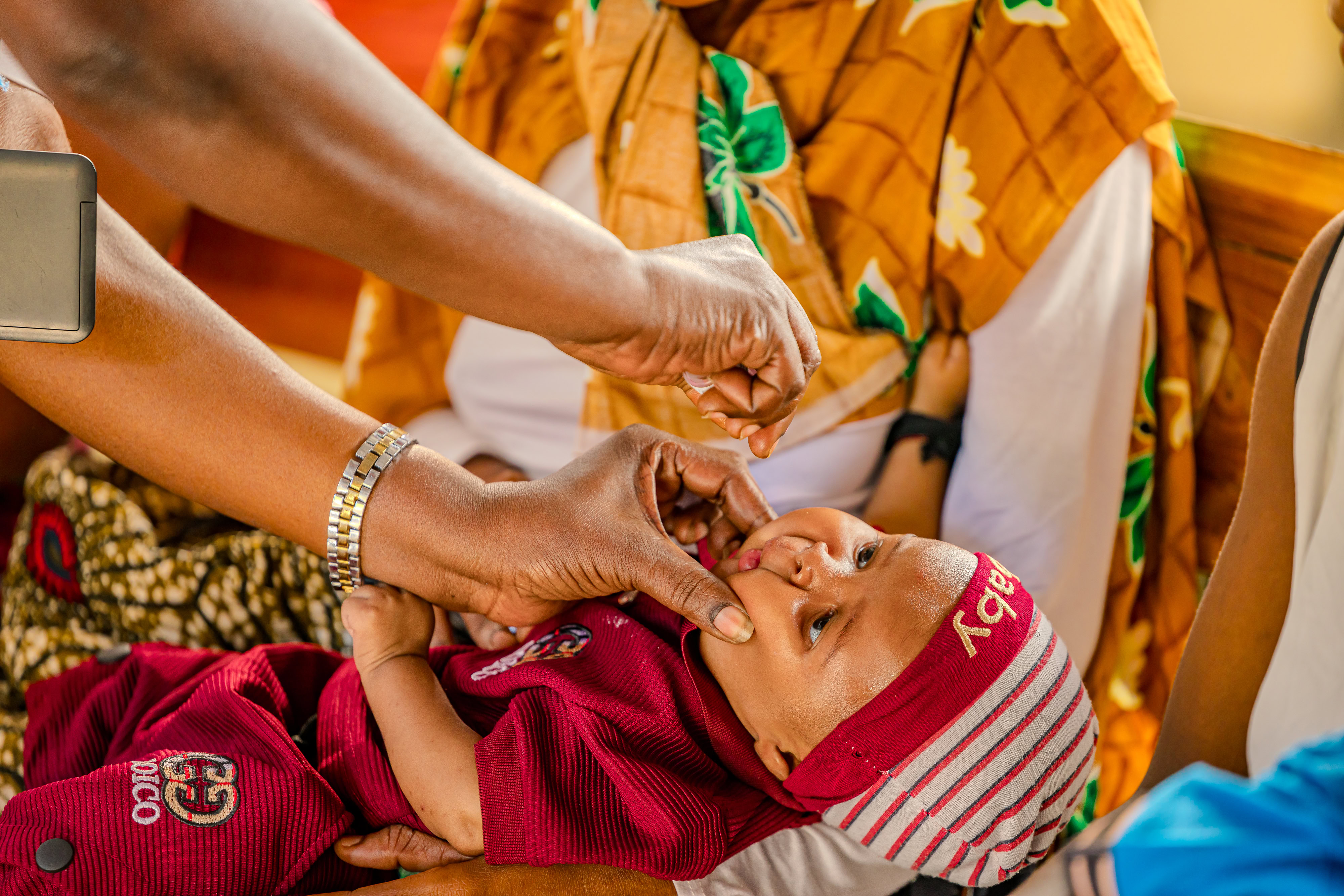 A child receives a dose of vitamin A supplementation