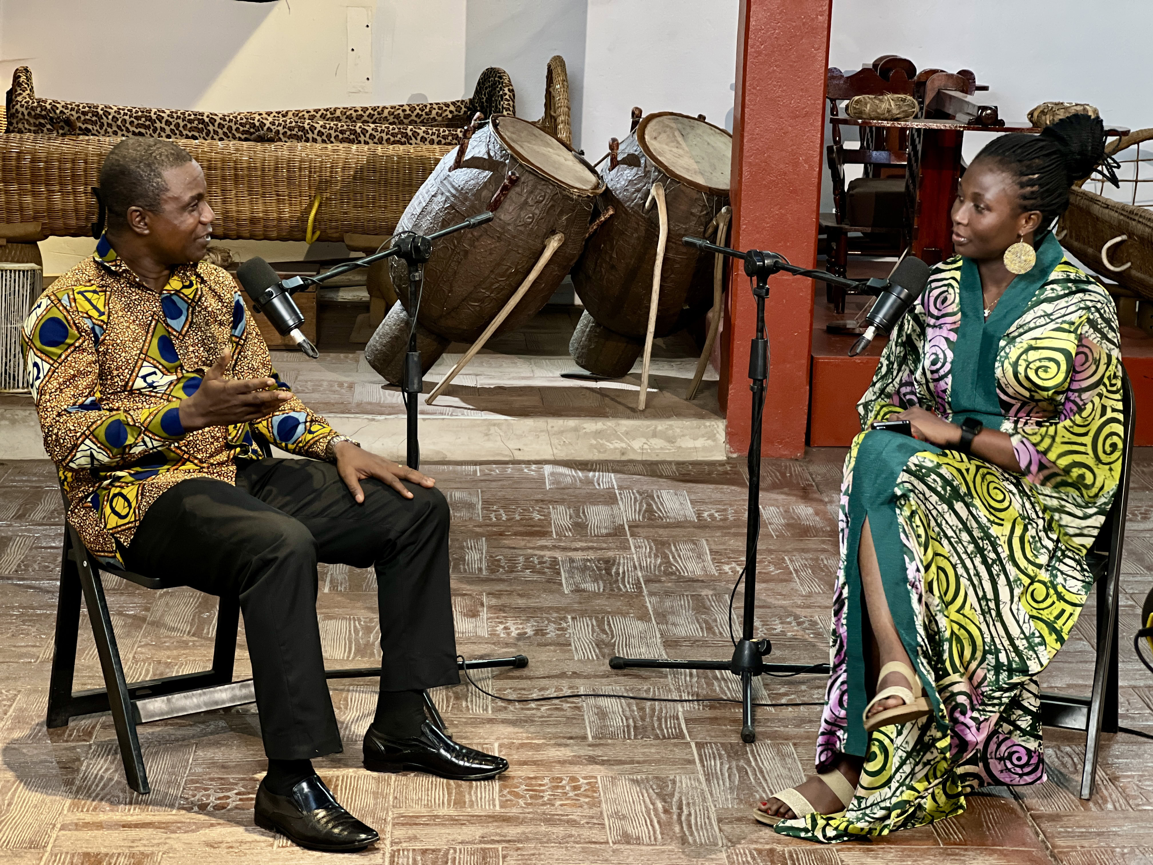 A female journalist interviewing a man.