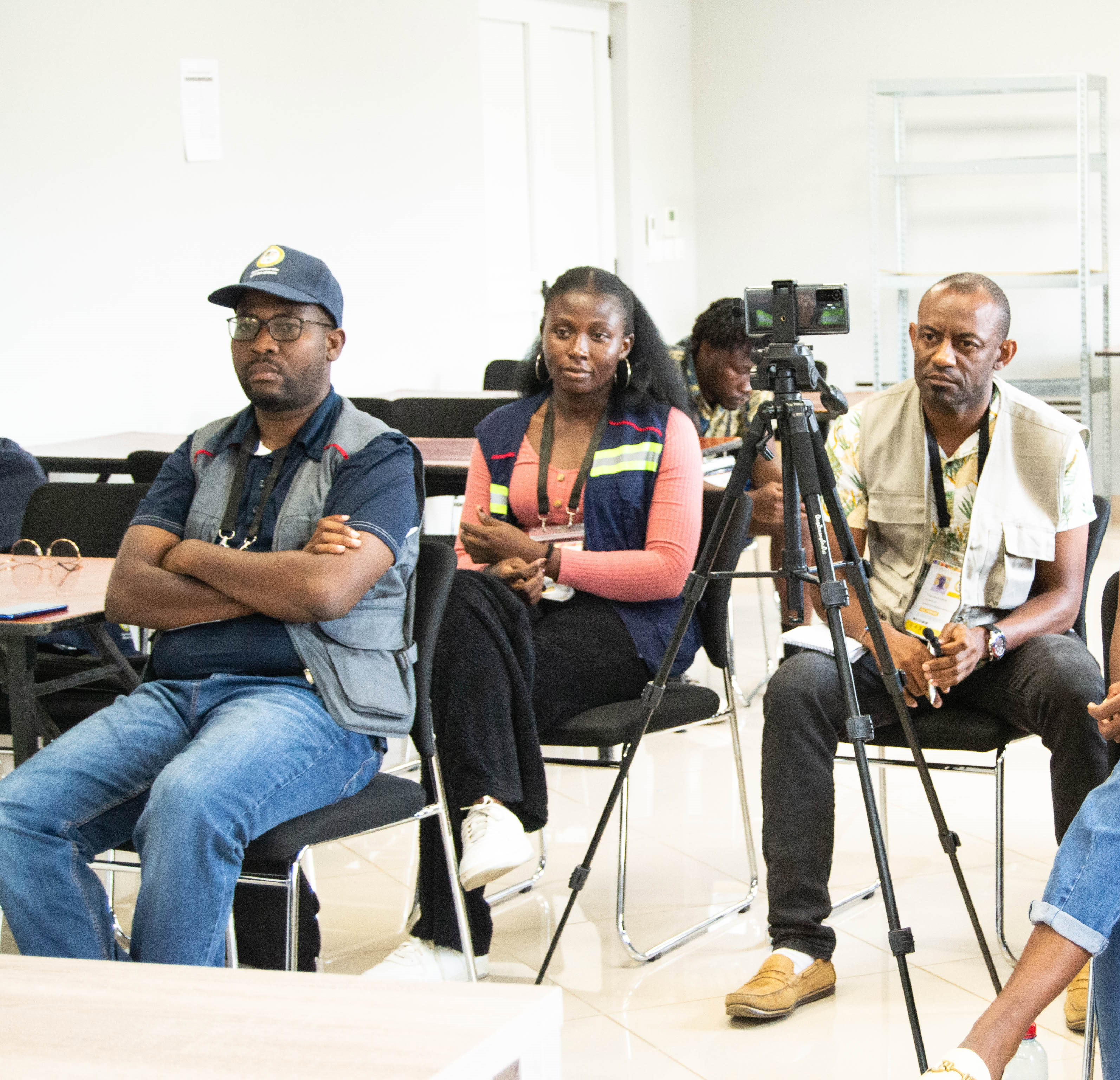 A group of journalists sitting and writing during conference.