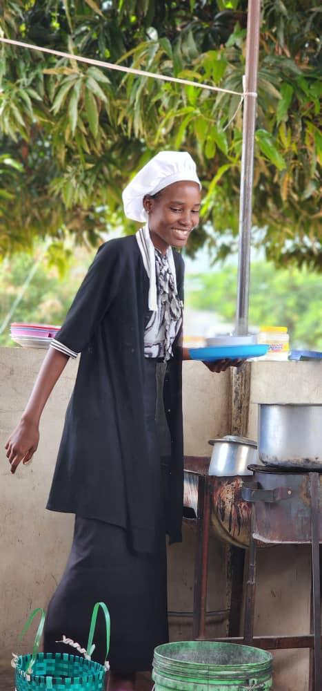 A woman smiling outside